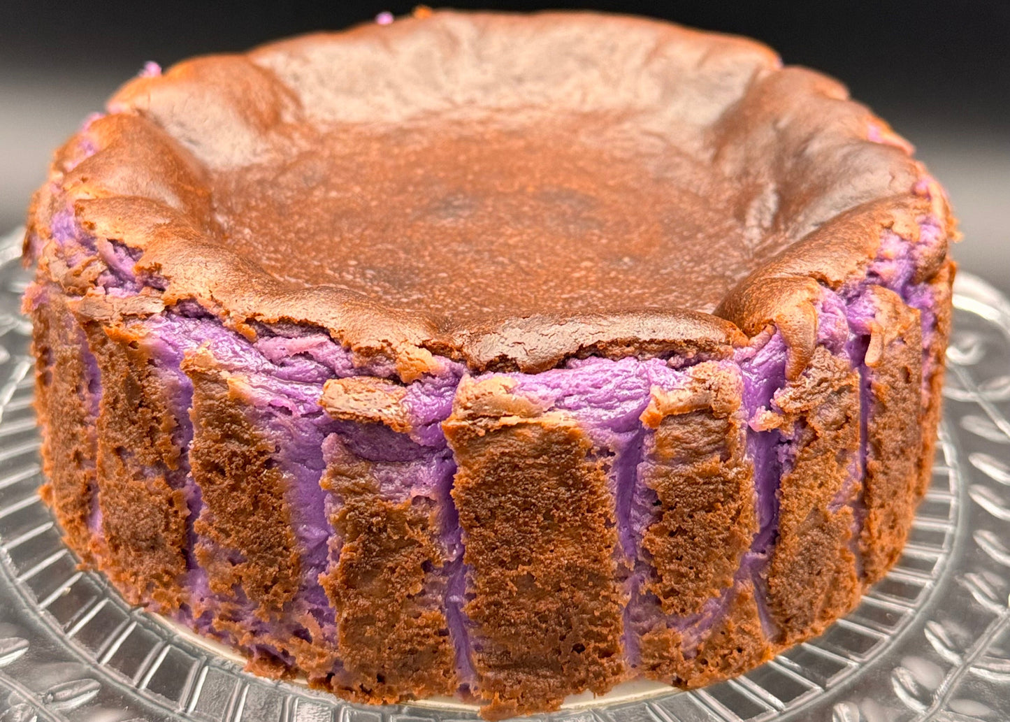 Ube Basque Burnt Cheesecake Gluten Free with a caramelized top and vibrant purple interior.