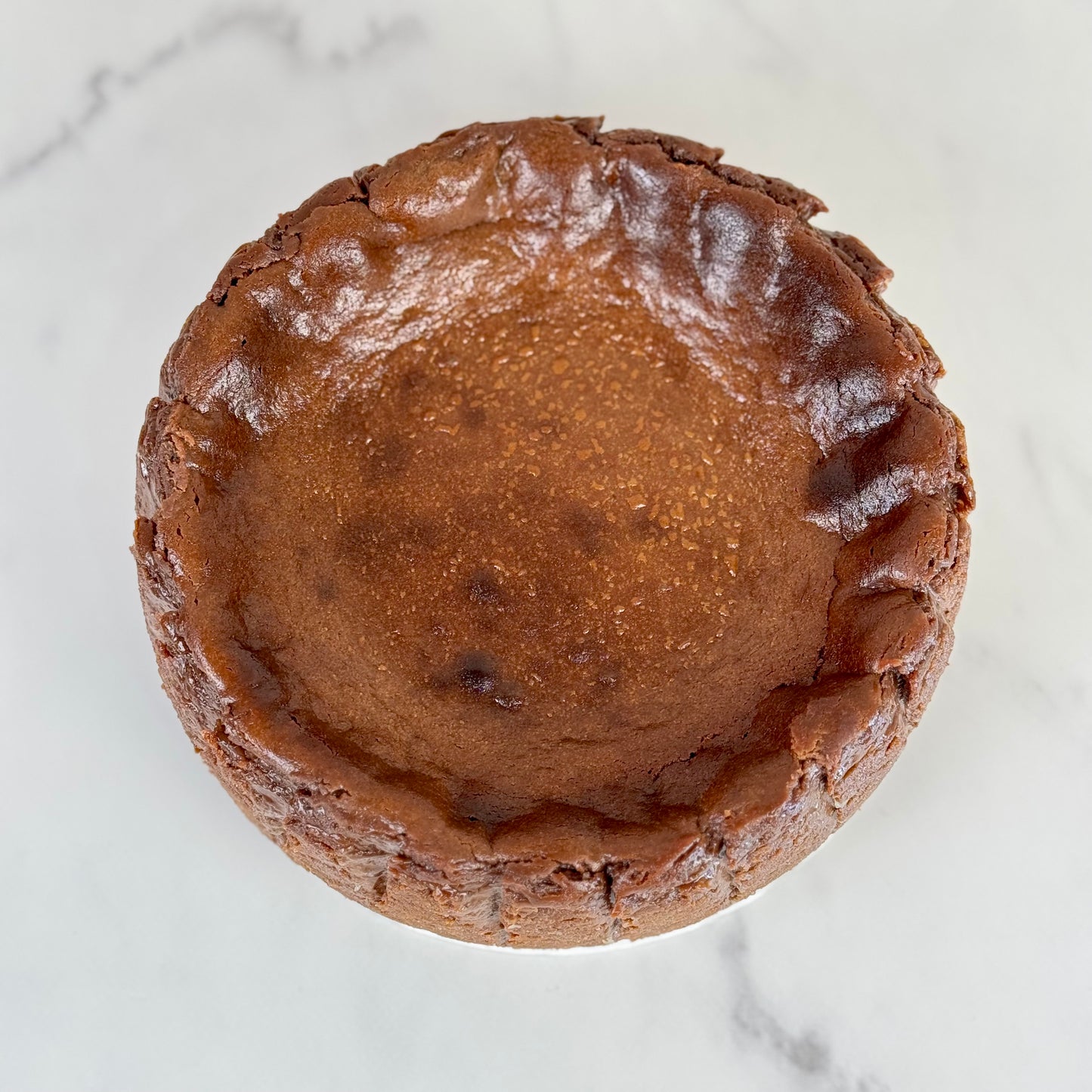 gluten free Chocolate burnt basque cheesecake 6 inch with a burnt caramelized top and creamy interior