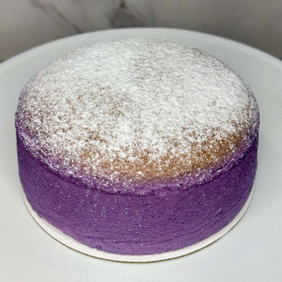 Light, airy Japanese cheesecake infused with vibrant ube purple yam, featuring a soft, jiggly texture and delicate sweetness