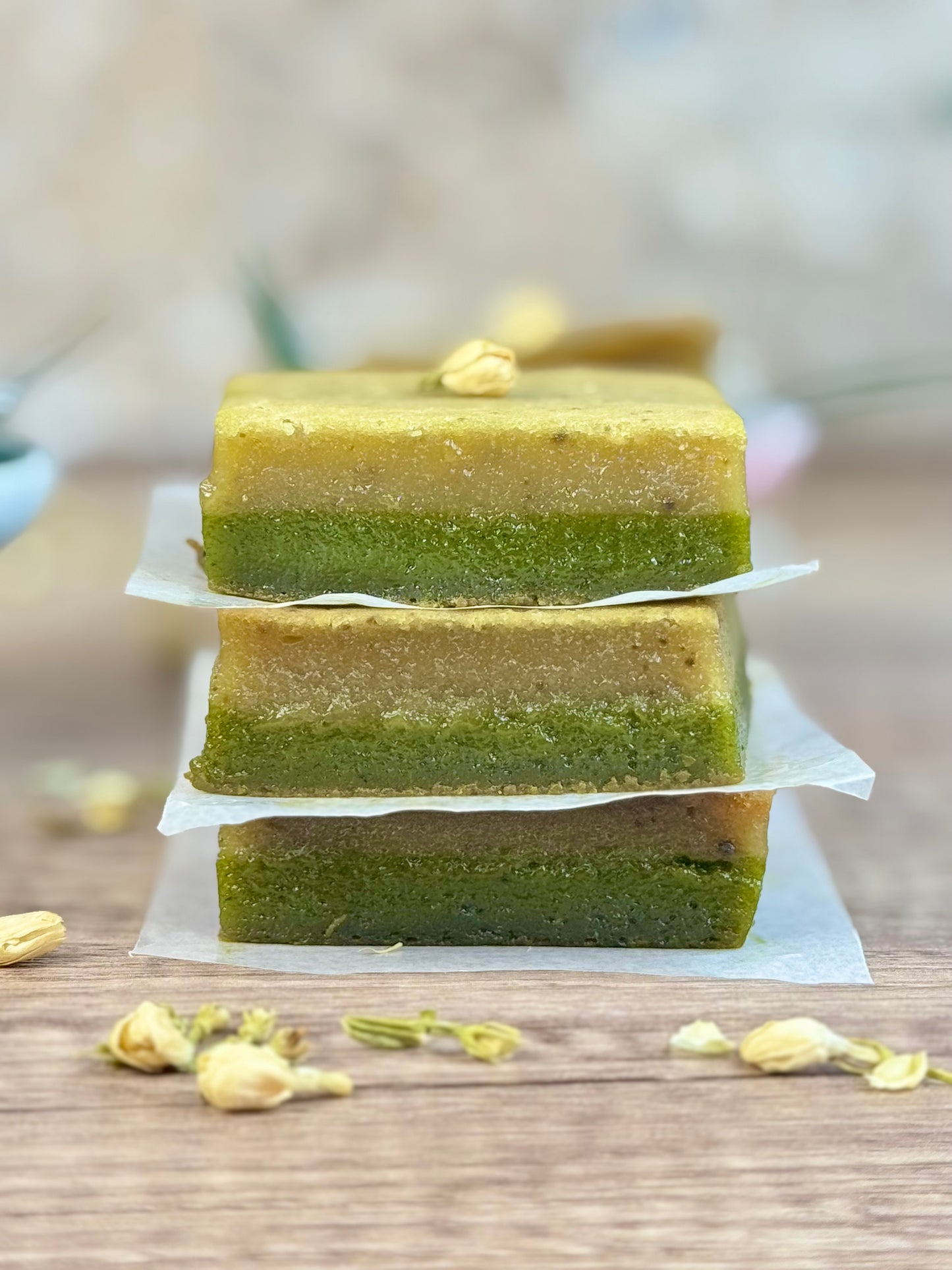 Vegan Jasmine Matcha Mochi Cake, three layered pieces stacked with jasmine and matcha flavors.