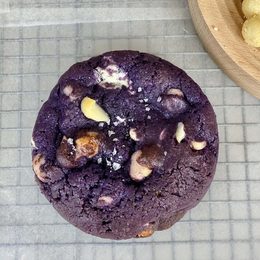 Ube White Chocolate Macadamia Cookies, thick chewy cookie with ube, white chocolate chunks, and macadamia nuts.