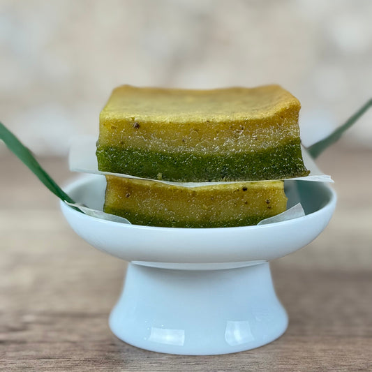 Vegan Jasmine Matcha Mochi Cake, showcasing the two vibrant layers of matcha and jasmine flavors.