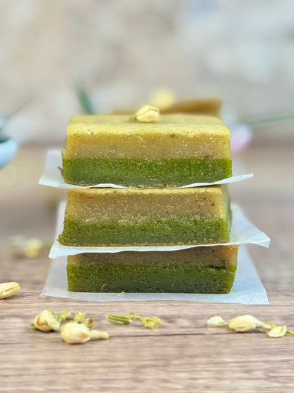 Vegan Jasmine Matcha Mochi Cake, three layered pieces stacked with jasmine and matcha flavors.